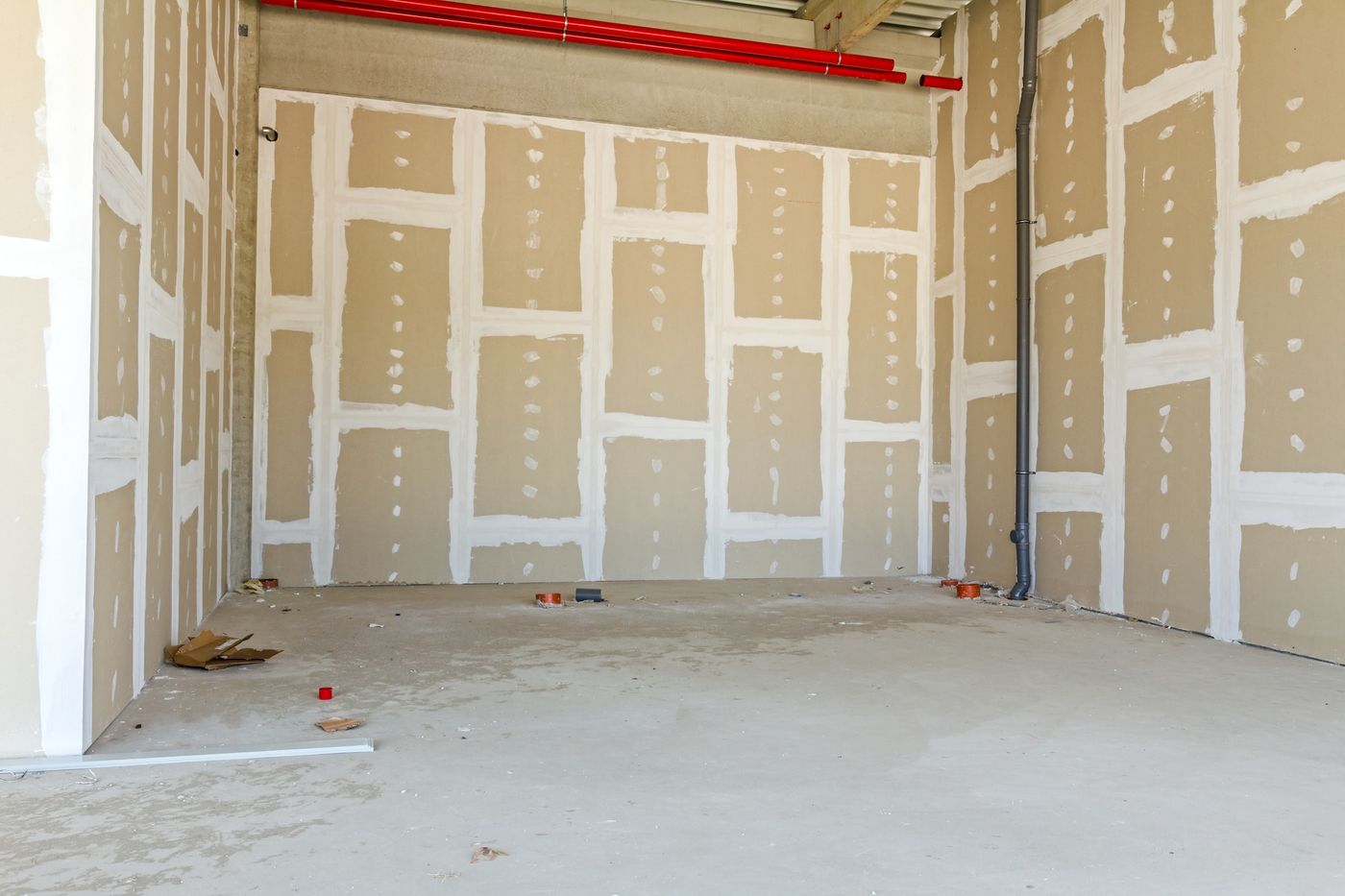 Large commercial room taped and ready to prime