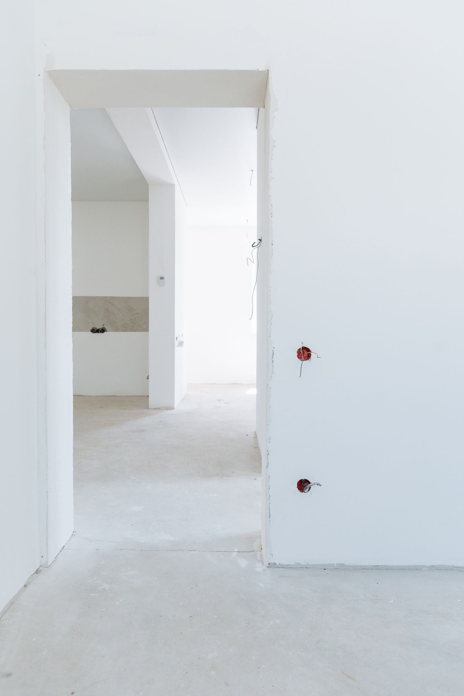 Freshly finished drywall hallway, bright and paint-ready