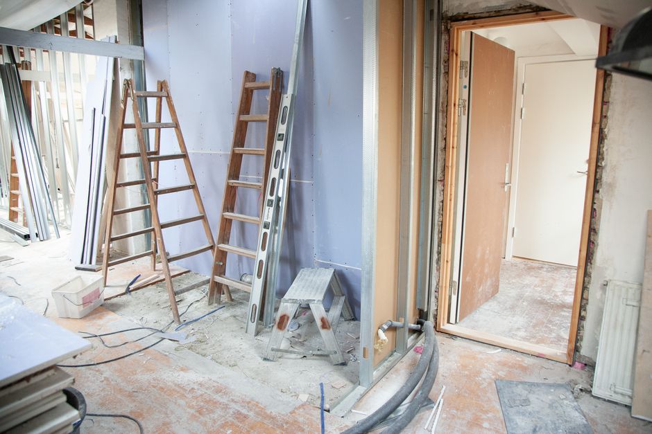 Drywall boards and metal framing mid-installation
