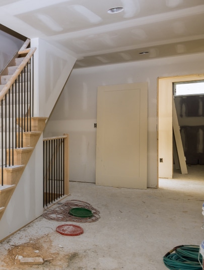 Finished residential stairway and hallway, freshly drywalled and painted