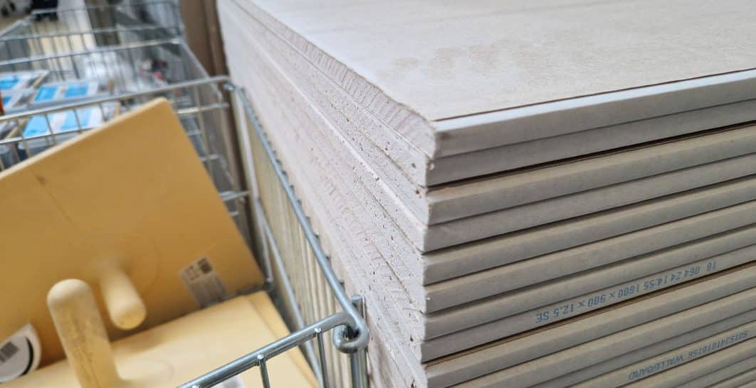 Stacked gypsum drywall panels ready for a fire-rated wall assembly