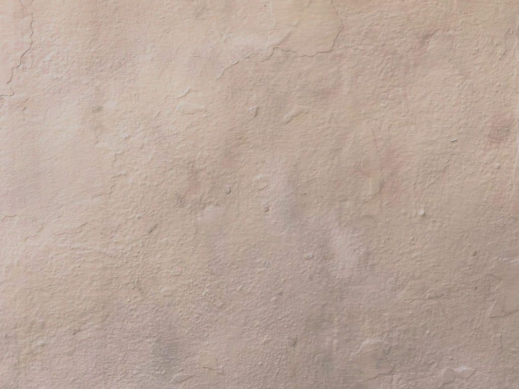 Close-up of a mottled knockdown texture pattern on a drywall surface