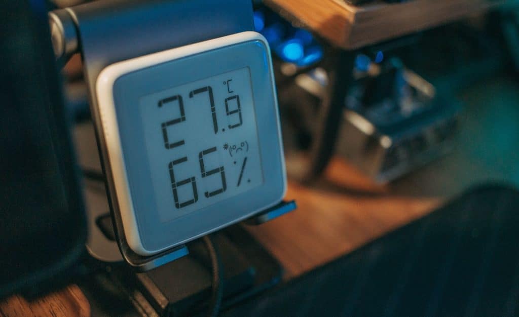 Hygrometer showing indoor relative humidity level on a wall