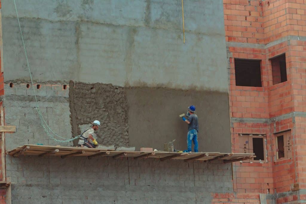 Exterior construction site showing wall sheathing before siding installation