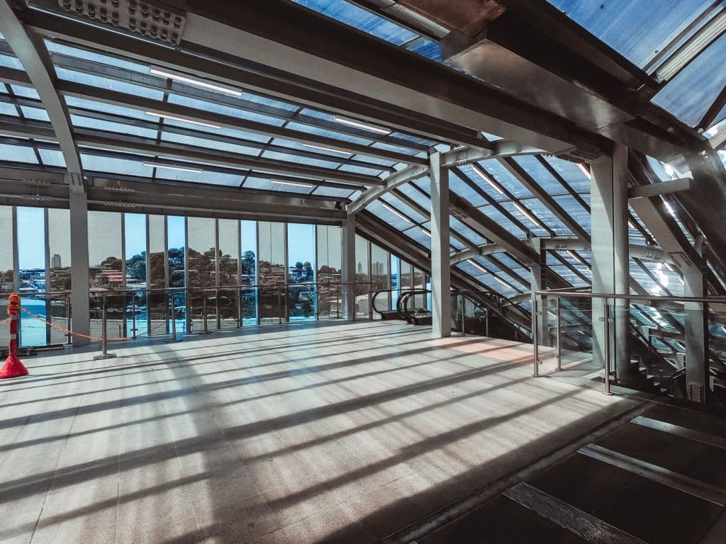 Modern building interior with glass ceiling and steel structural framing