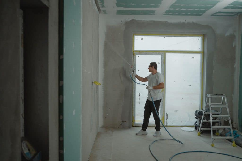 Room under renovation with tools and materials during repair work